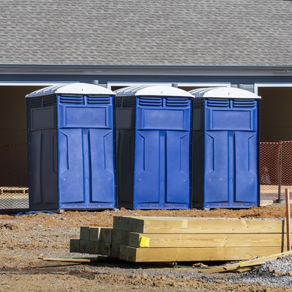 what is the cost difference between standard and deluxe portable toilet rentals in Trophy Club